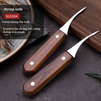 Anstrengungsfreie Zubereitung von Meeresfrüchten mit einem Garnelenpeeler aus Edelstahl und einem Fischbauchmesser