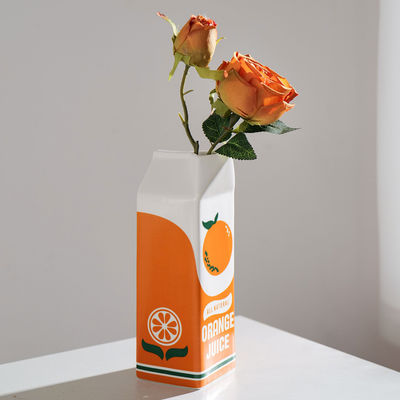 Kleine moderne keramische hydroponische Tischvase in orange Ideal für Zuhause und Restaurant